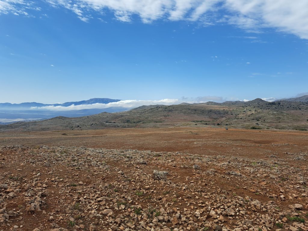 Last view of the mountains and the distant clouds before the descent into Loja