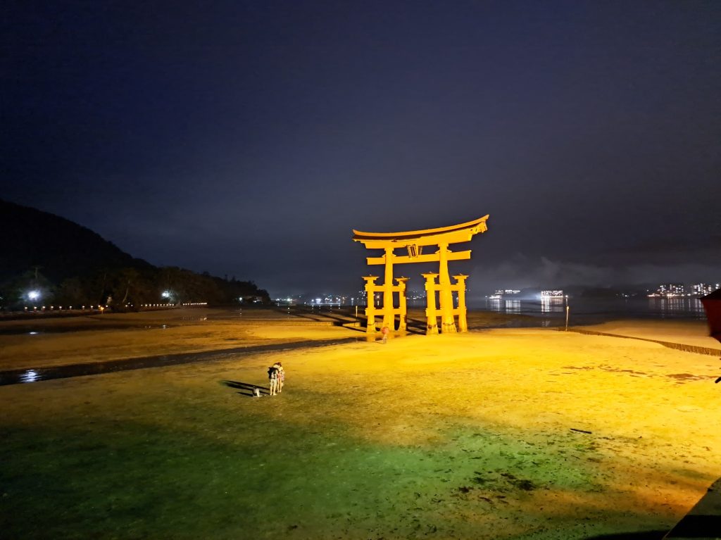 The Great Torii gate at night, with the sea out
